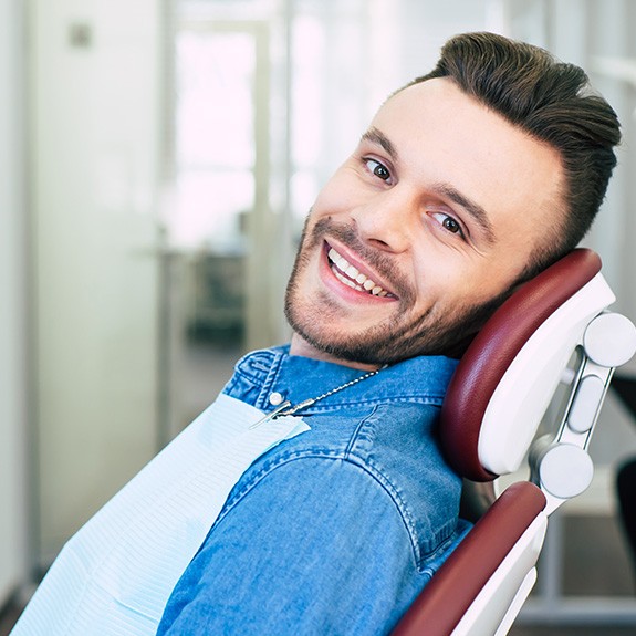 Patient in Fort Worth smiling after tooth-colored filling treatment